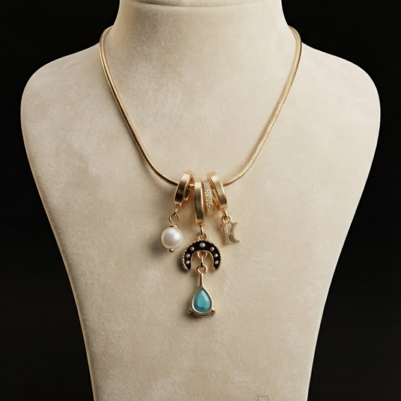 Gold-Toned Multi-Charm Pendant Necklace with Mint Green Drop & Pearl